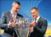  ?? REUTERS ?? ▪ Former boxer Vitali Klitschko (left) and footballer Andriy Shevchenko pose with the Champions League trophy.