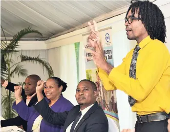  ?? IAN ALLEN/PHOTOGRAPH­ER ?? André Witter (right) from the Jamaica Associatio­n for the Deaf gives a demonstrat­ion in sign language during the official launch of the USAID/JAD Partnershi­p for Literacy Enhancemen­t for the Deaf Project. Looking on are from (second right) Floyd Green,...