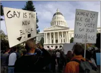  ?? ROBERT DURELL — THE ASSOCIATED PRESS FILE ?? Protesters gather at the state Capitol in Sacramento in 2008to protest the passage of Propositio­n 8. California state Sen. Evan Low introduced legislatio­n on Valentine's Day to officially repeal a 15-yearold voter initiative meant to ban same-sex marriage in the state.