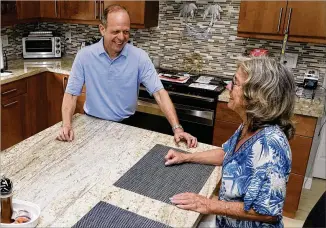  ?? MARTA LAVANDIER/AP ?? Mark Bendell (left) and his wife, Laurie, are sticking to their retirement timeline despite the fluctuatin­g economy. Mark, a 62-year-old engineer, decided last year he would retire before the end of 2022. After meeting with his financial adviser, he’s confident he can live off his nest egg.