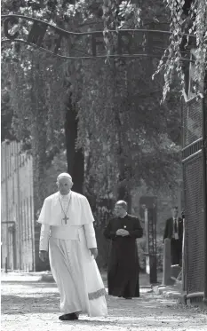  ?? AGENCE FRANCE PRESSE ?? Pope Francis leaves through the main entrance gate to the Auschwitz Nazi death camp in Oswiecim, as part of his visit to the World Youth Days (WYD). He is in Poland for an internatio­nal Catholic youth festival with a mission to encourage openness to...