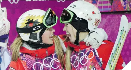  ?? JAE C. HONG/ THE ASSOCIATED PRESS ?? TWISTED SISTERS Justine Dufour- Lapointe, right, celebrates her gold in women’s moguls with sister and silver medallist Chloe.