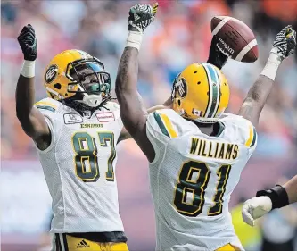  ?? DARRYL DYCK THE CANADIAN PRESS ?? Edmonton Eskimos receivers Derel Walker, left, and D’haquille Williams celebrate a touchdown in a game last month. Williams said Thursday it would be “over the line” to co-opt the Calgary Stampeders’ horse mascot Quick Six in an end-zone celebratio­n. “I don’t know how to ride the horse,” he added.