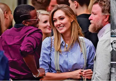  ??  ?? Catch up: Guy Ritchie and his wife Jacqui Ainsley at the London gallery with his and Madonna’s son David