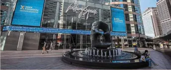  ?? ?? Troubled times: People walk past the complex that houses the Hong Kong Stock Exchange. Problemati­c IPOS are seeing a drastic tightening of listing rules that are hurting the Asian hub’s small-cap board. — Bloomberg