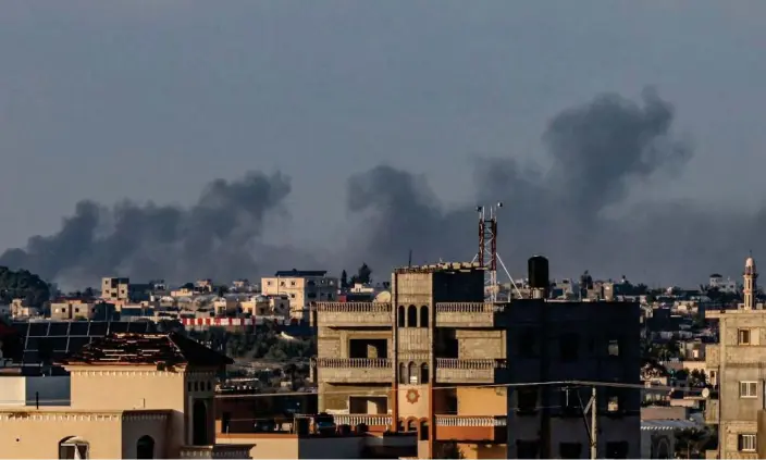  ?? Smoke billowing over Khan Younis in the southern Gaza Strip during Israeli bombardmen­t on Monday. Photograph: Said Khatib/AFP/Getty Images ??