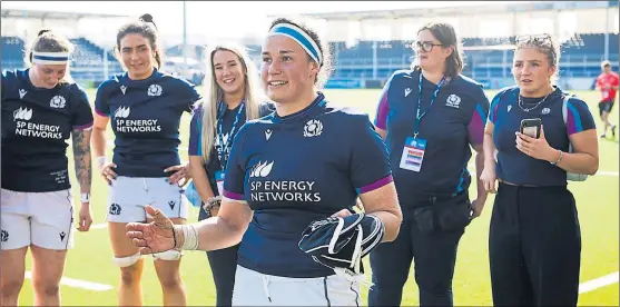  ?? ?? Scotland captain Rachel Malcolm, centre, was thrilled with the announceme­nt of a support package from Scottish Rugby