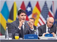  ?? G20 PRESS OFFICE THE ASSOCIATED PRESS ?? Prime Minister Justin Trudeau said he told Russian President Vladimir Putin of the need to release Ukrainian sailors.