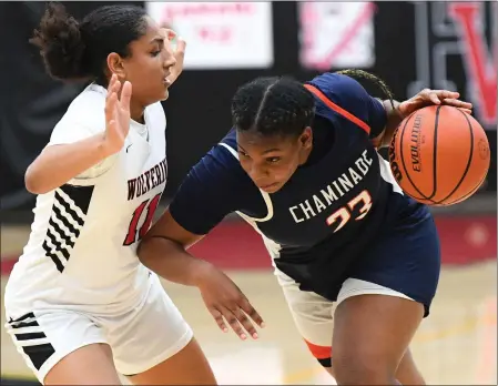  ?? PHOTO BY ANDY HOLZMAN ?? Chaminade's Payton Montgomery, right, drives while under pressure from Harvard-Westlake's Deana Thompson in a Mission League game Thursday.