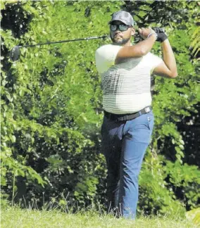  ?? (Photo: Paul Reid) ?? William Knibbs tees off on the 16th hole on Monday’s second day of the 53rd JGA Open presented by Aqua Bay played at the Tryall Golf Club in Hanover. Knibbs scored a one under par 215 to win the amateur section.