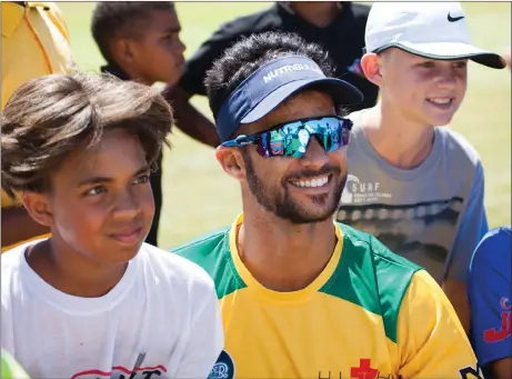  ?? Picture: DANIEL SAAIMAN ?? IT’S ALL FOR THE KIDS: JP Duminy poses with some of his fans for photograph­s during his Super Eights Charity Cricket Day in Paarl yesterday.