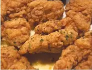  ?? AP PHOTO/CHARLES KRUPA ?? An order of “boneless chicken wings” rests on a plate Tuesday in Derry, N.H.