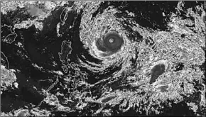  ??  ?? Typhoon Trami builds in the West Pacific.(Photo: CNN)