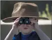  ?? KARL MONDON — STAFF PHOTOGRAPH­ER ?? Leo Knudsen, 4, goes on a neighborho­od teddy bear hunt in San Jose.