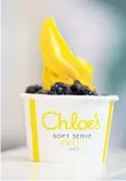  ??  ?? A cup of vegan mango soft serve with blackberri­es at Chloe’s Soft Serve Fruit Co.