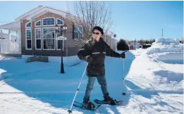  ??  ?? Gérard Ste-Croix snowshoes along Domaine de la Florida’s Cocoa Avenue in March in Quebec’s Saint-Ambroise, Canada.