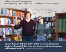  ?? Minneapoli­s Star Tribune/TNS ?? Lauren Richards (left) and Caitlin O’Neil, co-owners of romance bookstore Tropes & Trifles, pose for a picture inside their bookstore in Minneapoli­s, April 4.