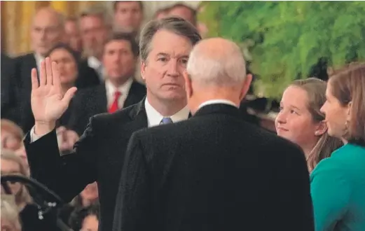  ?? ALEX WONG/GETTY IMAGES ?? Supreme Court Justice Brett Kavanaugh participat­es in a ceremonial swearing-in by retired Justice Anthony Kennedy on Monday.