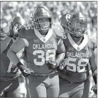  ?? AP FILE PHOTO ?? Oklahoma fullback Dimitri Flowers (36) celebrates a touchdown with teammate Erick Wren (58) on Oct. 7 against Iowa State in Norman, Okla. No. 2 Oklahoma and No. 3 Georgia meet for the first time today at the Rose Bowl in a College Football Playoff...