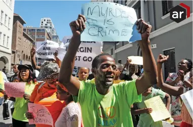  ?? PICTURE: CINDY WAXA/ AFRICAN NEWS AGENCY (ANA) ?? SPEAKING OUT: A group of people protest outside the Western Cape High Court during the appearance of Wasief Buxbey who is accused of murdering Robyn Pearce in Sea Point.