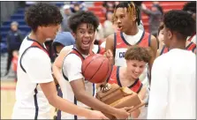  ?? MIKE CABREY — MEDIANEWS GROUP ?? Plymouth Whitemarsh’s Jaden Colzie celebrates while holding the Suburban One League Tournament championsh­ip trophy after the Colonials’ 68-40win over Central Bucks East in the final on Tuesday.