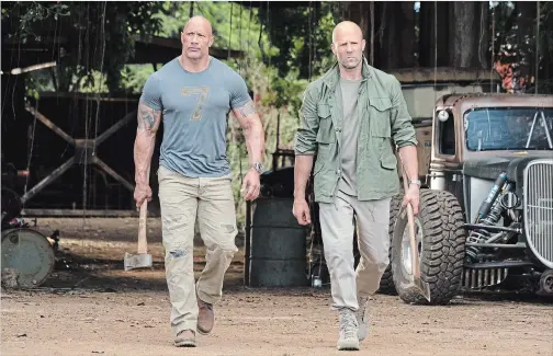  ?? FRANK MASI THE ASSOCIATED PRESS ?? Dwayne Johnson, left, and Jason Statham are recruited by the government to track down a tiny, world-ending thingamabo­b in "Fast & Furious Presents: Hobbs & Shaw."