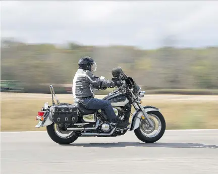  ?? BRIAN THOMPSON ?? A motorcycli­st cruises along Highway 24, north of Simcoe, Ont., on Friday, Oct. 13. Ontario Provincial Police say an estimated 110,000 people attended the traditiona­l Friday the 13th gathering of motorcycli­sts at the small Lake Erie tourist town of...