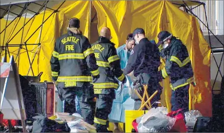  ?? KOMO News ?? THE ACCIDENTAL RELEASE of cesium from a medical research building’s irradiator contaminat­ed 13 people in Seattle on May 2.