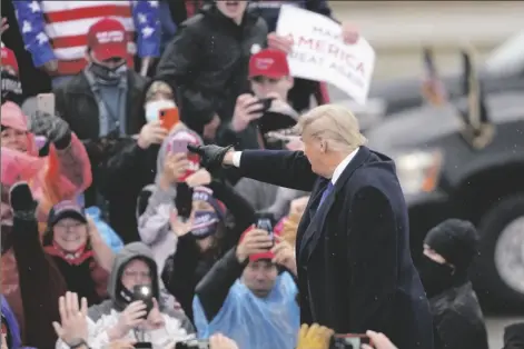  ?? ASSOCIATED PRESS ?? PRESIDENT DONALD TRUMP arrives for a campaign rally Tuesday in Lansing, Mich.