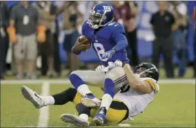  ?? AP photo ?? Giants quarterbac­k Josh Johnson is sacked by Steelers linebacker T.J. Watt during a preseason game Friday.
