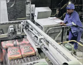  ?? PHOTO: BLOOMBERG ?? A worker at a PPC plant. PPC is working on contingenc­y plans to ensure it can keep its cement operations in Zimbabwe running and pay employees.