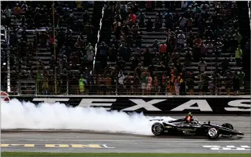  ?? AP PHOTO BY RANDY HOLT ?? In this June 8, 2019, file photo, Josef Newgarden celebrates winning the Indycar auto race at Texas Motor Speedway in Fort Worth, Texas. Indycar has gotten the green flag to finally start its season in Texas. The race will be run June 6 without spectators at Texas Motor Speedway.