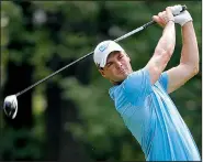  ?? AP/TONY GUTIERREZ ?? Germany’s Martin Kaymer tees off on No. 3 Thursday during the first round of the PGA Championsh­ip. Kaymer finished with a 4-under 66 that left him in a three-way tie for second heading into today’s second round.