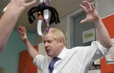  ?? AP ?? BRITISH DEAL MAKER: Britain’s Prime Minister Boris Johnson visits the children’s ward of Milton Keynes University Hospital in Milton Keynes, England, Friday. Johnson is getting opposition to his Brexit deal from his allies in Northern Ireland, even as the European Union grants England more time to broker the deal.