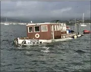  ?? PHOTO BY CURTIS HAVEL ?? After an overnight storm brought strong winds and heavy rain, the 85-foot motor vessel Suisun sits partially submerged in Richardson Bay .