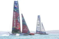  ?? - AFP photo ?? American Magic team (R) competes against Emirates Team New Zealand on practice racing day five of the Prada America’s Cup World Series and Prada Christmas Race in Auckland.