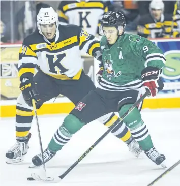  ?? BOB TYMCZYSZYN/STANDARD FILE PHOTO ?? Niagara IceDogs Jordan Maletta (9) fights off Kingston Frontenacs Stephen Desrocher in Ontario Hockey League action on March 17, 2016, at Meridian Centre in St. Catharines.