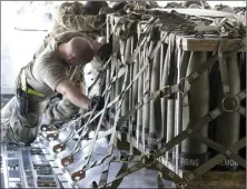  ?? AP photo ?? Airmen push over 8,000 pounds of 155 mm shells ultimately bound for Ukraine on to a C-17 aircraft for transport Friday at Dover Air Force Base, Del. President Joe Biden asked Congress on Thursday for $33 billion to bolster Ukraine’s fight against Russia, signaling a burgeoning and long-haul American commitment.