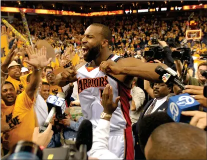  ?? BOB PEPPING — CONTRA COSTA TIMES, FILE ?? The Warriors' Baron Davis is surrounded by fans and media after defeating the Mavericks in Game 6of a 2007first-round playoff series.