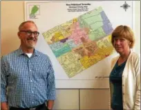  ?? BRIAN MCCULLOUGH – DIGITAL FIRST MEDIA ?? John Weller and Mimi Gleason stand in front of a zoning map in the West Whiteland Township Building. Township officials are seeing renewed interest in developing in the township.