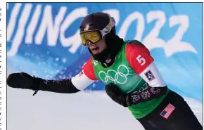  ?? (AP/Lee Jin-man) ?? Lindsey Jacobellis of the United States won the gold medal in snowboardc­ross racing, 16 years after giving away a gold medal in Italy with a showboat move near the finish line. Jacobellis, 36, became the oldest U.S. woman to win a gold medal in Winter Games history.