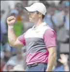  ?? Mark Humphrey The Associated Press ?? Rory McIlroy celebrates after birdieing No. 18 to take the lead of the FedEx St. Jude Invitation­al on Saturday in Memphis, Tenn.