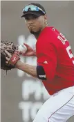  ?? AP PHOTO ?? SPINNING IT: Ivan De Jesus looks to make a play to first during yesterday’s game against the Twins in Fort Myers.