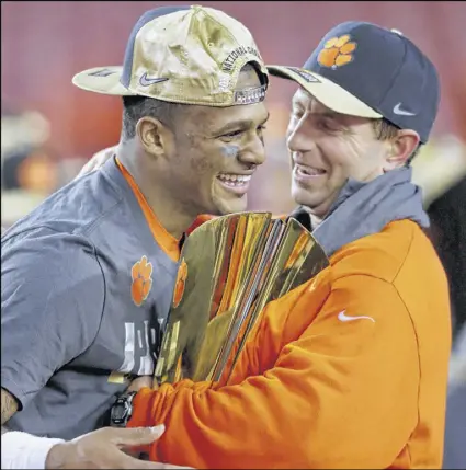  ?? STREETER LECKA / GETTY IMAGES ?? Clemson QB Deshaun Watson and coach Dabo Swinney, celebratin­g the win over Alabama, vow the Tigers will build on their success. “It’s going to be even more exciting,” Watson said.