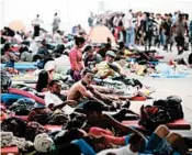  ?? ALFREDO ESTRELLA/GETTY-AFP ?? Migrants from one caravan rest at a temporary shelter set up in a Mexico City stadium.