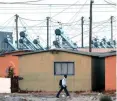  ?? KRUGER HENK ?? RDP houses near Harare in Khayelitsh­a fitted with solar heating panels. |