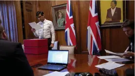  ??  ?? Recovery plans... Chancellor Rishi Sunak checks his Spending Review