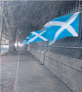  ??  ?? Nobody yet knows why the Saltire flags were placed on the railings of Baxter Park, along a section of Arbroath Road, then swiftly removed again.