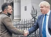  ?? UKRAINIAN PRESIDENTI­AL PRESS OFFICE ?? Ukrainian President Volodymyr Zelenskyy, left, and Britain’s Prime Minister Boris Johnson shake hands Saturday in Kyiv, Ukraine.