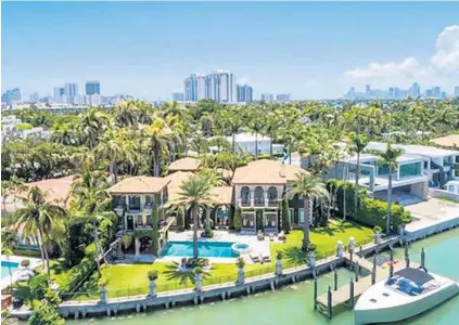  ?? JORGE URIBE/COURTESY ?? The eight-bedroom, eight-bathroom Mediterran­ean estate at 2345 Lake Ave., is located on Sunset III in Miami Beach.